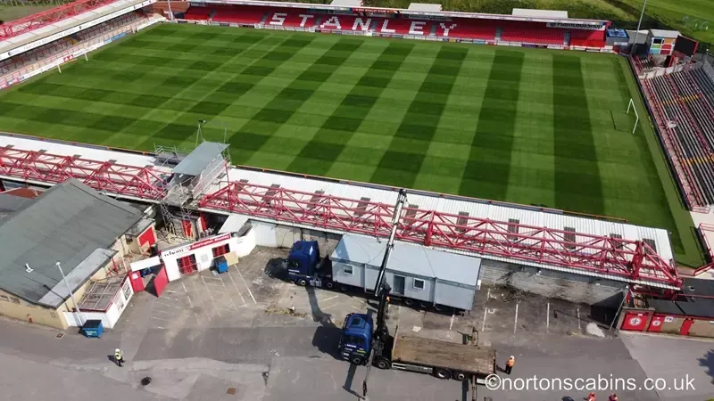 Cabins and HIAB delivery seen from above — delivered to Rochdale