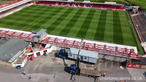 Aerial view of stadium and trucks
