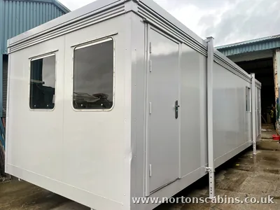 Bespoke 32x10ft cabin with open-plan kitchen and toilet