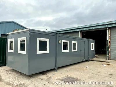 Refurbished 32x10ft open-plan cabin with carpet