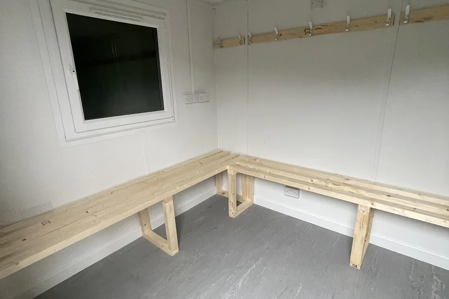 Changing room with corner benches Changing room with corner benches