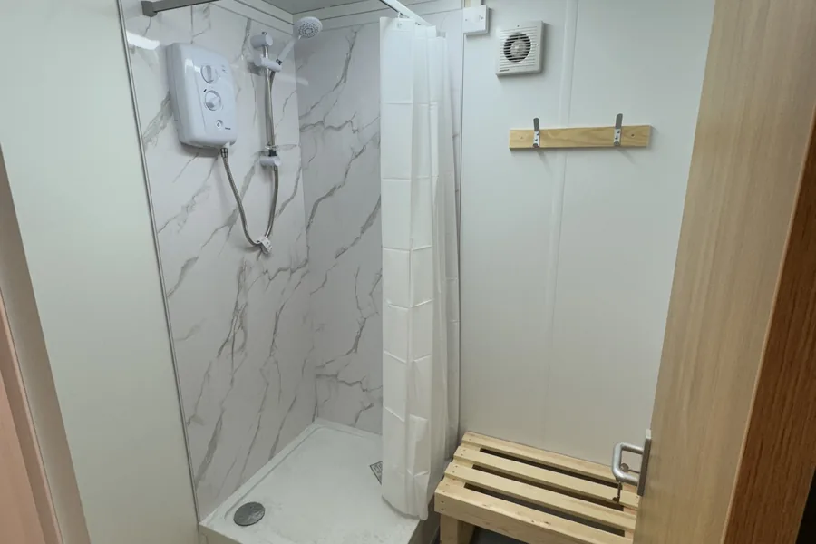 Changing room shower with bench seat Changing room shower with bench seat