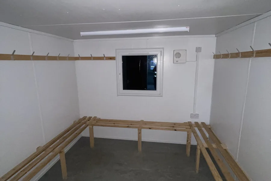 Drying room with bench seating and hooks Drying room with bench seating and hooks
