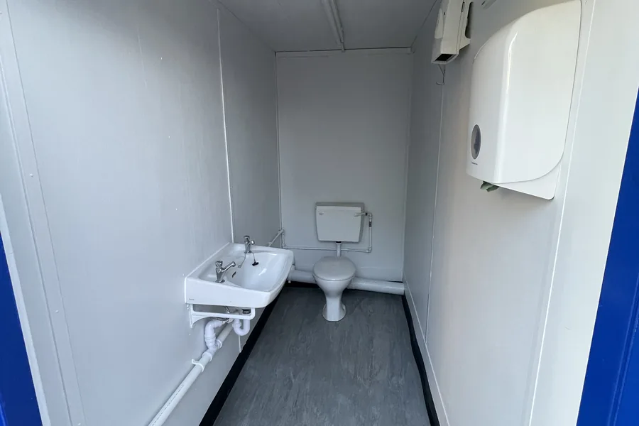 Toilet cabin with wash basin and wc