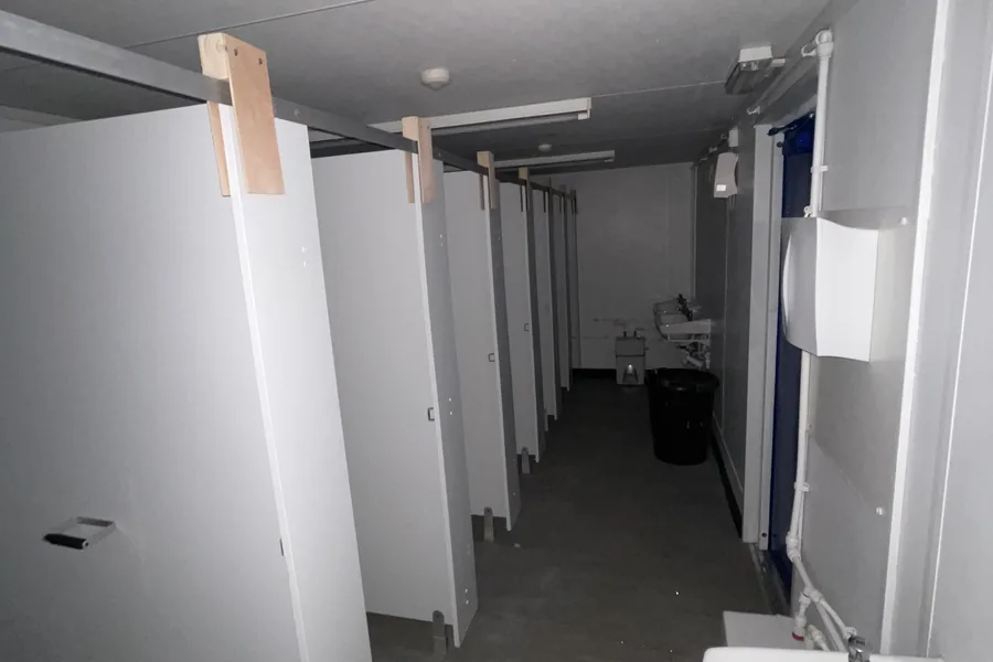 Toilet block cubicles corridor