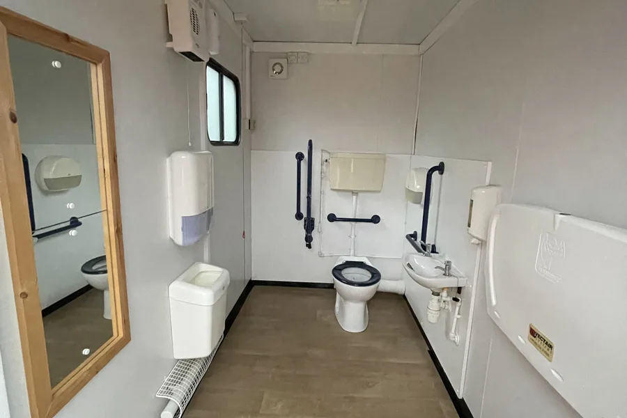 Accessible toilet with grab rails