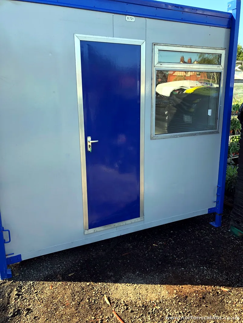 Container office with lockable personnel door and opening window